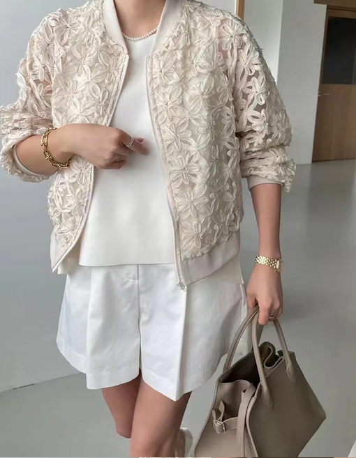 Textured cream floral mesh bomber jacket with white shorts